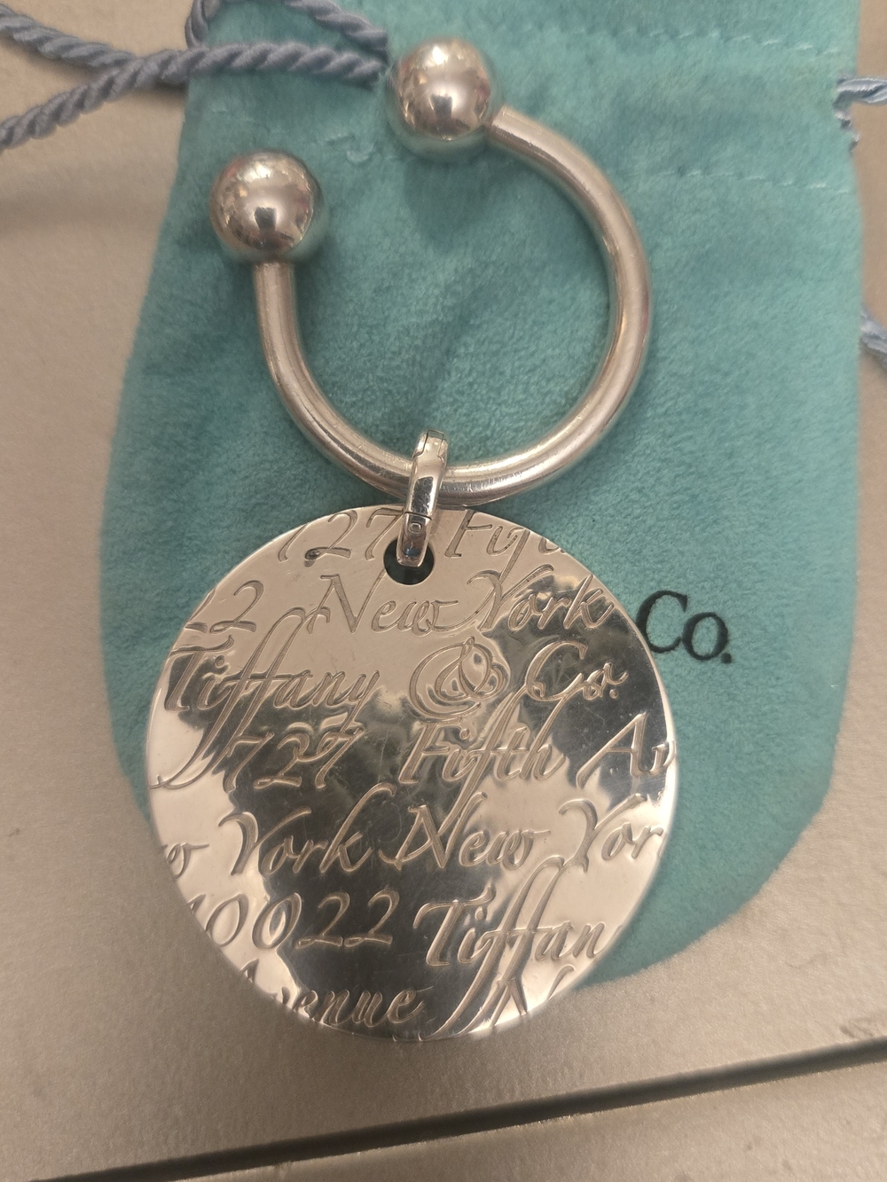 Tiffany & Co. Silver Engraved Round Keyring with Blue-Green Pouch